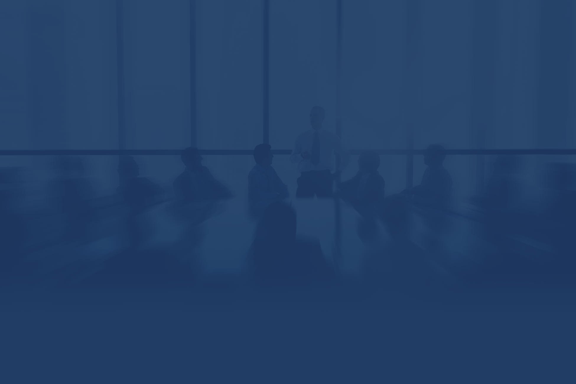 Silhouetted business team in meeting room